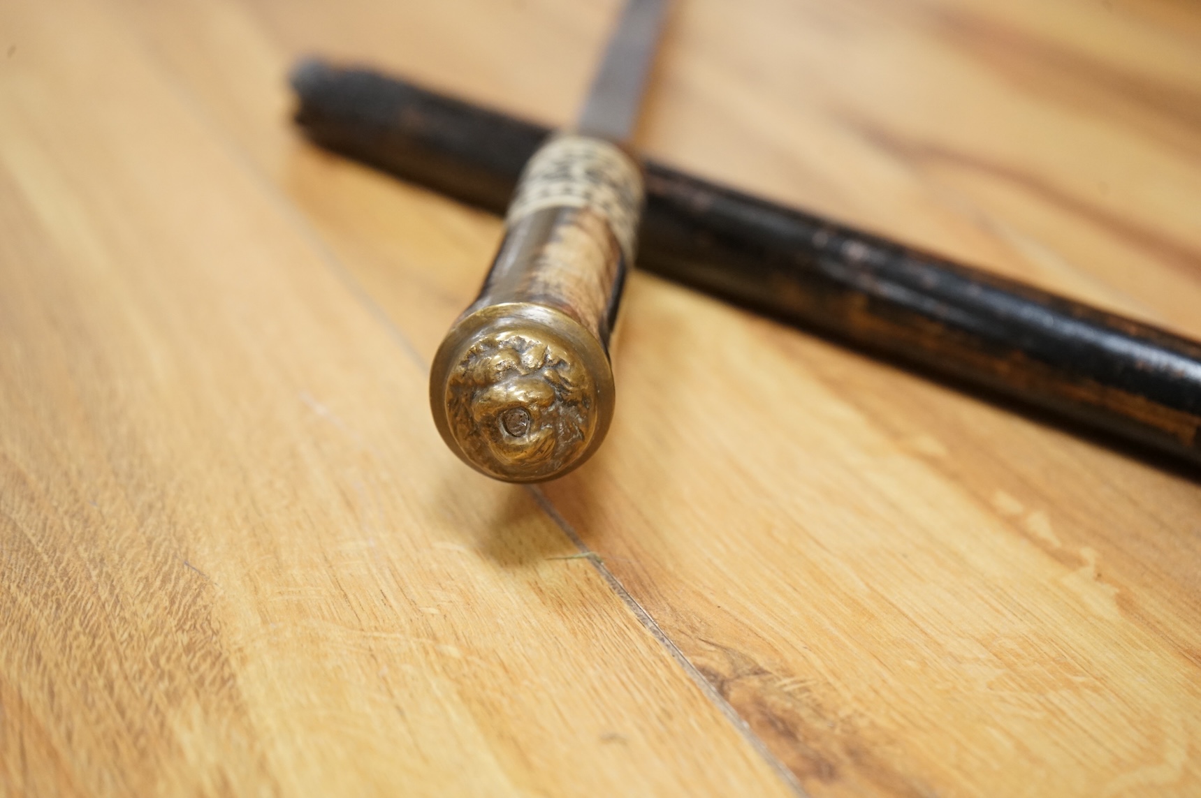 An early 20th century Indonesian sword stick with bone inlay, 92cm in length